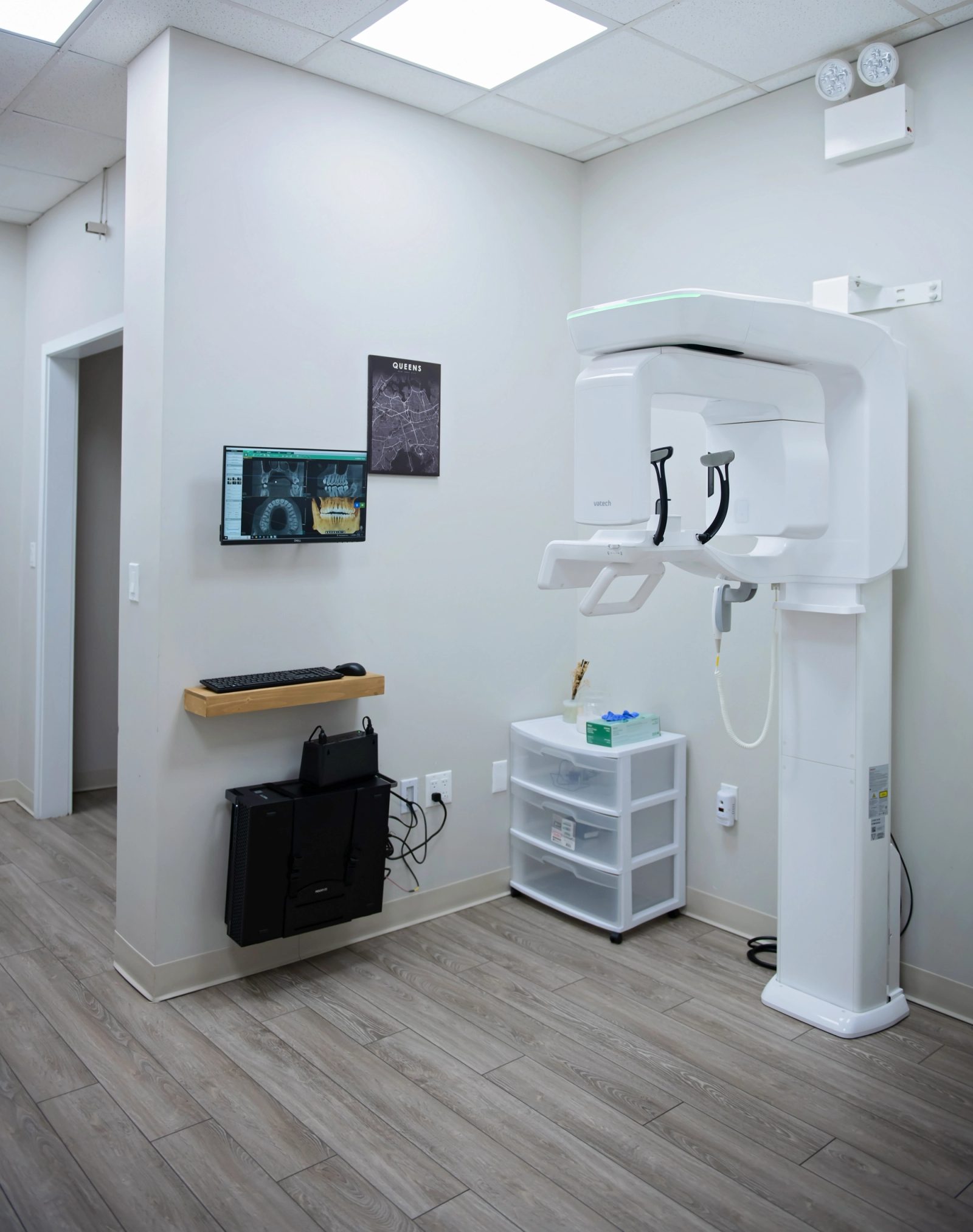 a dental office with a dental chair and a monitor .